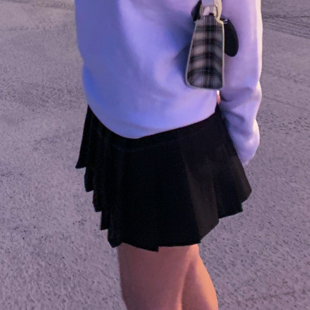 black pleated skirt